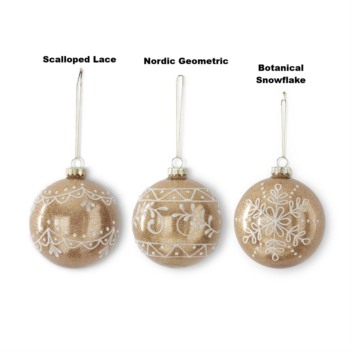 Three gold glittered glass ornaments with white scalloped lace, nordic, and snowflake designs.