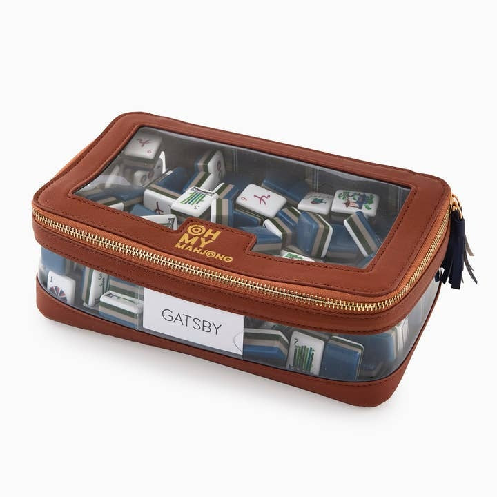 Cognac brown leather and clear plastic mahjong tile storage bag with a Gatsby label.