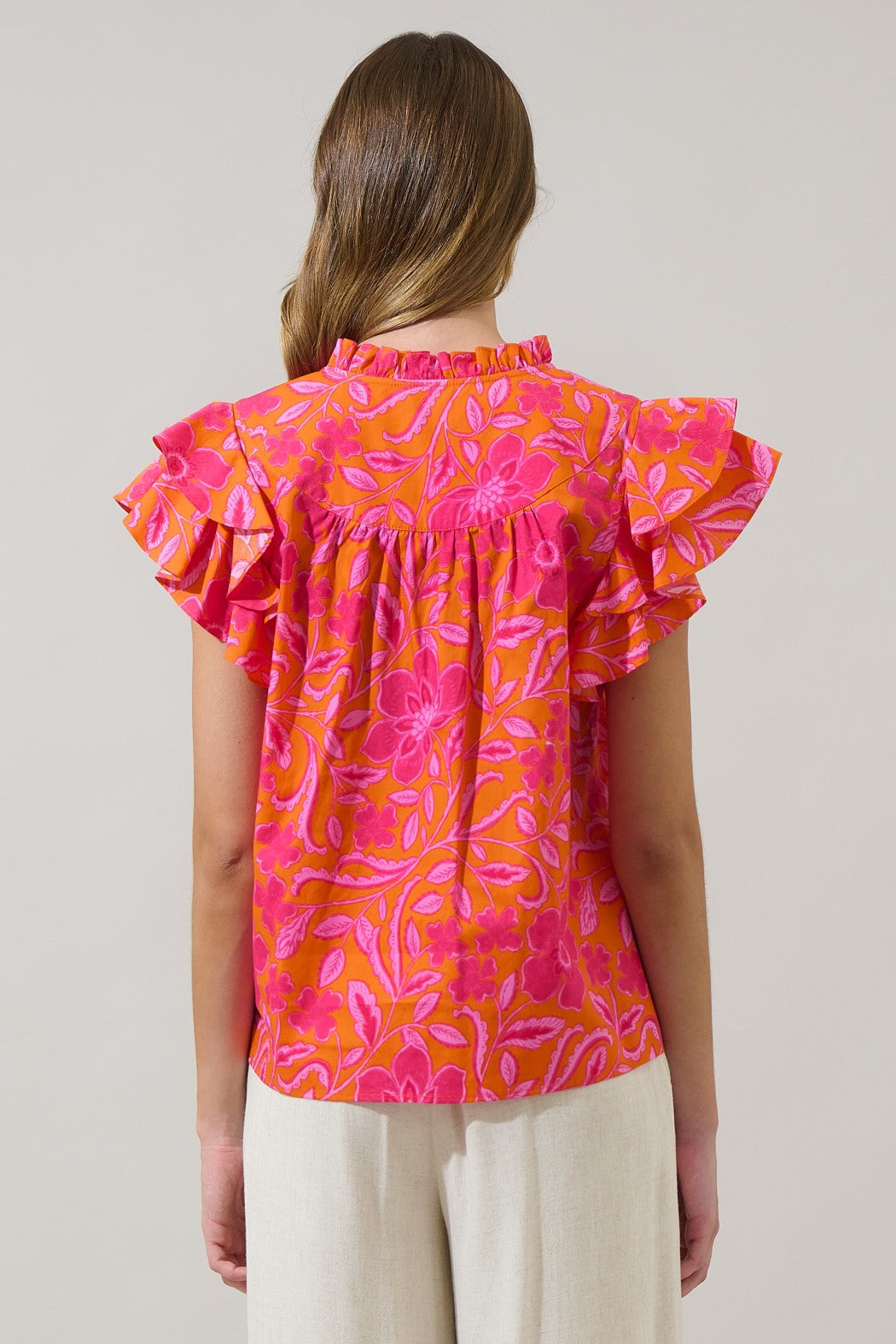 Rea Floral Emery split neck top in floral print cotton fabric with a relaxed silhouette.