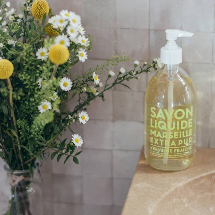 Glass pump bottle of Liquid Marseille soap in fresh verbena scent with botanical oils.