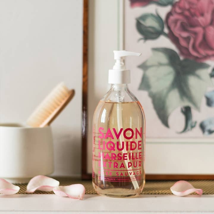 Glass pump bottle of Liquid Marseille soap in Wild Rose scent with botanical oils.