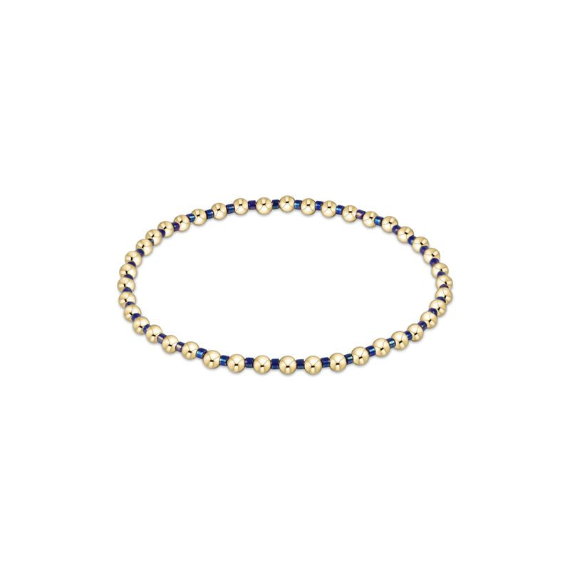 Hope Grateful bracelet featuring mixed 2mm seed beads in spring colors with gold-filled accents on elastic cord.