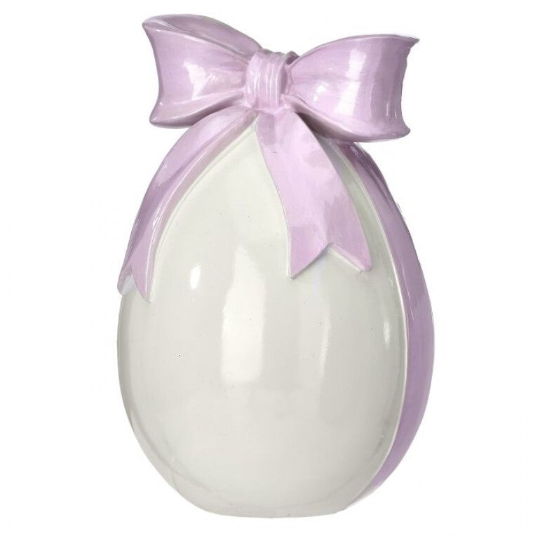 Hand-painted resin egg with a bowtie accent in glossy finish