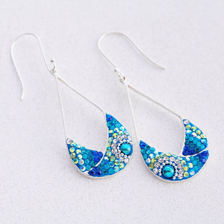 Split drop earrings in sterling silver featuring blue and white Austrian crystals.