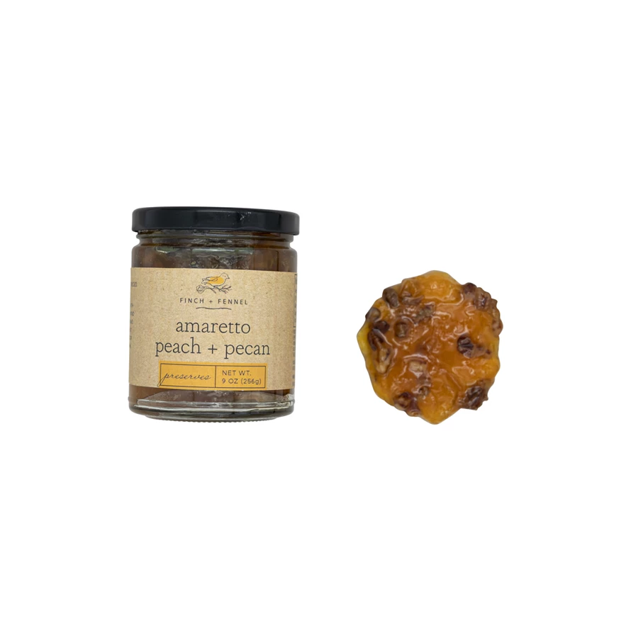 9oz jar of Amaretto Peach Pecan Preserves with a peach-colored lid and label.