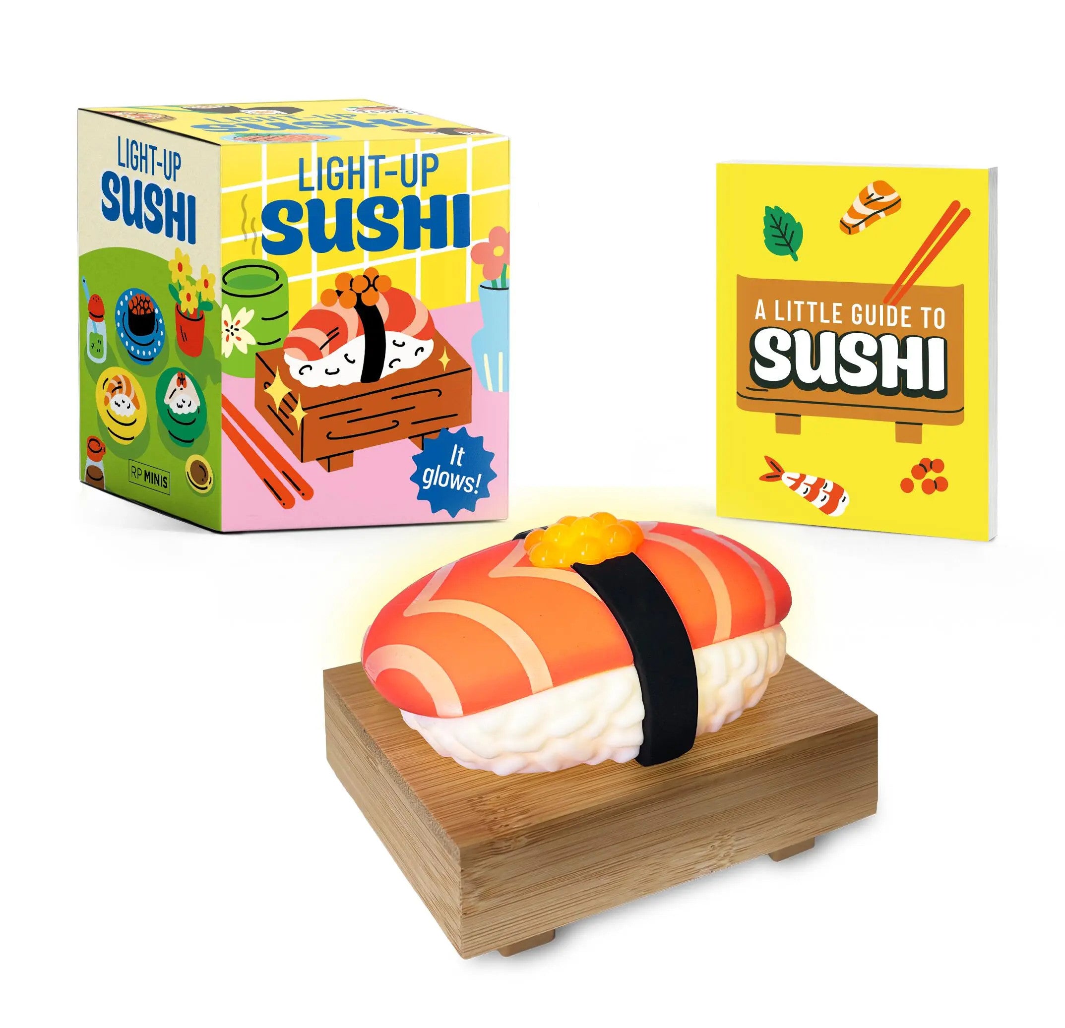 Wooden base holding a salmon-colored illuminated sushi nigiri replica with soft ambient glow.