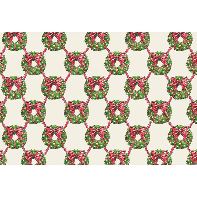 Holiday Wreath Lattice placemat featuring festive wreaths and ribbons in red, green, and cream tones on recycled paper.