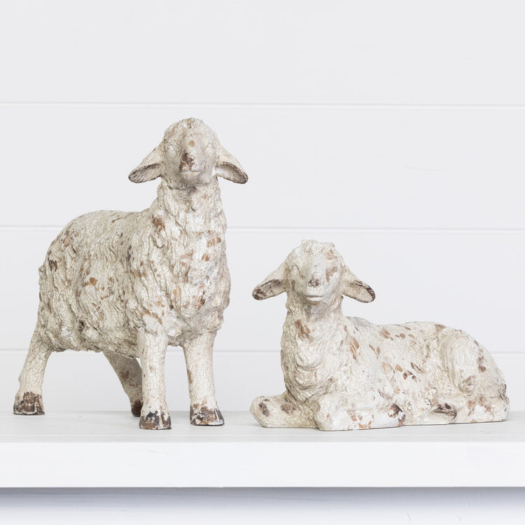 Resin decorative lamb figurine in natural tone with smooth curves.