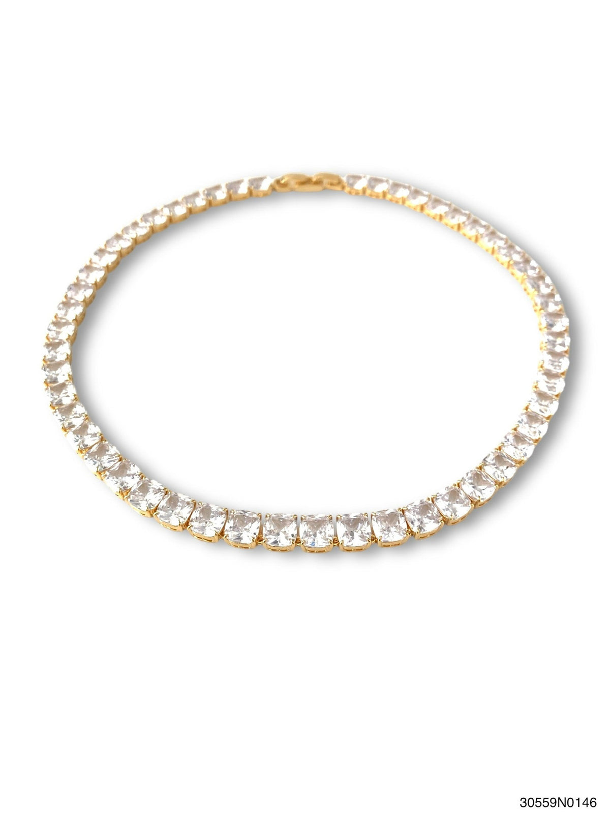 Gold Clair tennis necklace with cushion-cut CZ stones in a box closure.