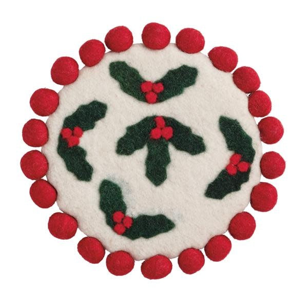 Classic Christmas felted wool trivet with holly appliqué pattern and red pom trim.