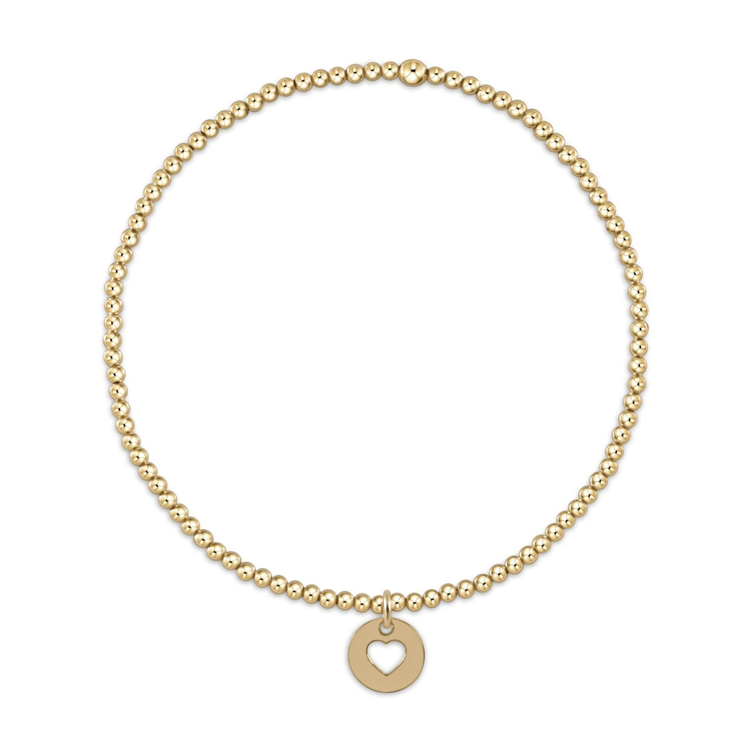 Gold-filled bracelet with 2mm beads and a small love disc charm
