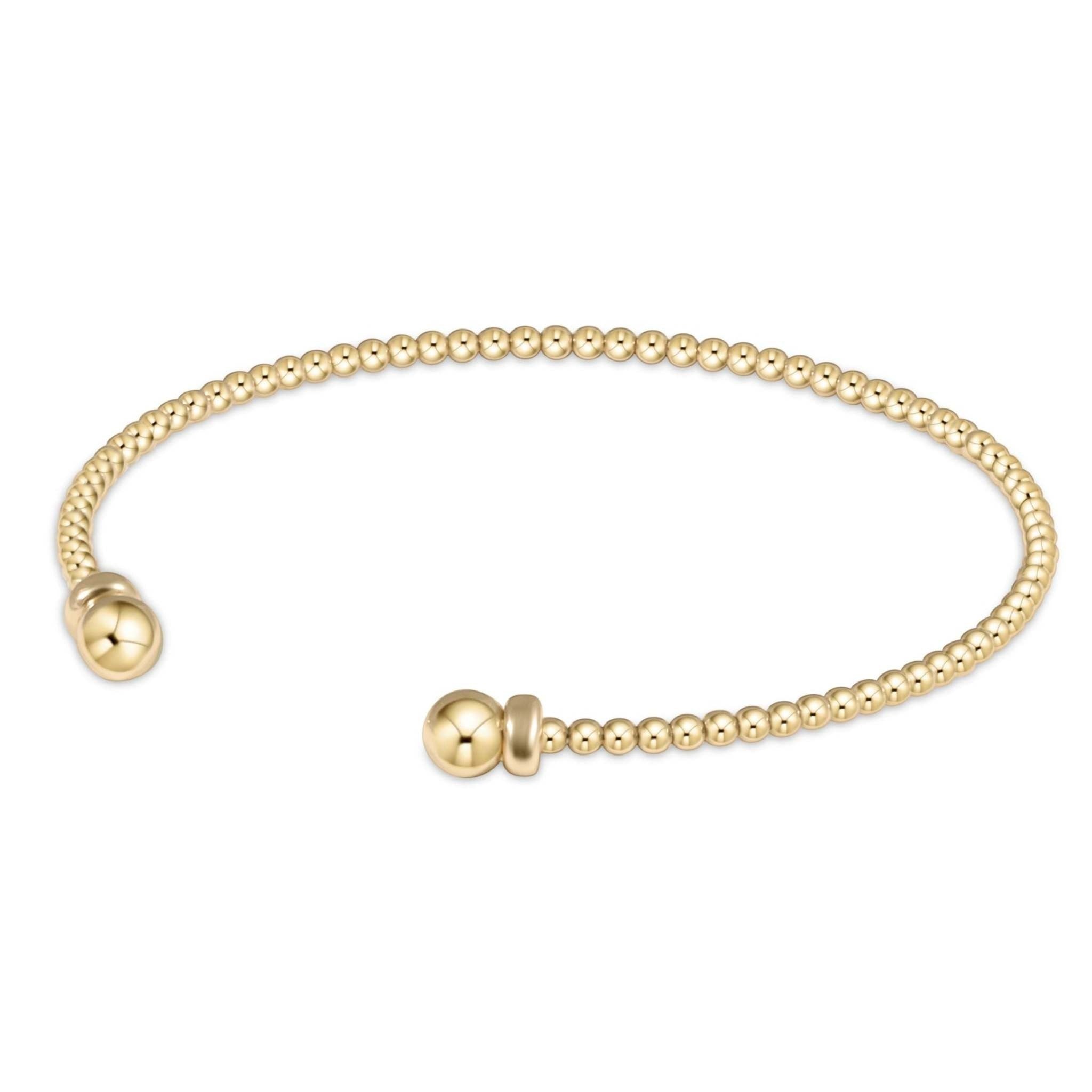 Gold-filled classic cuff bracelet featuring flexible 2mm beads in a solid gold silhouette.