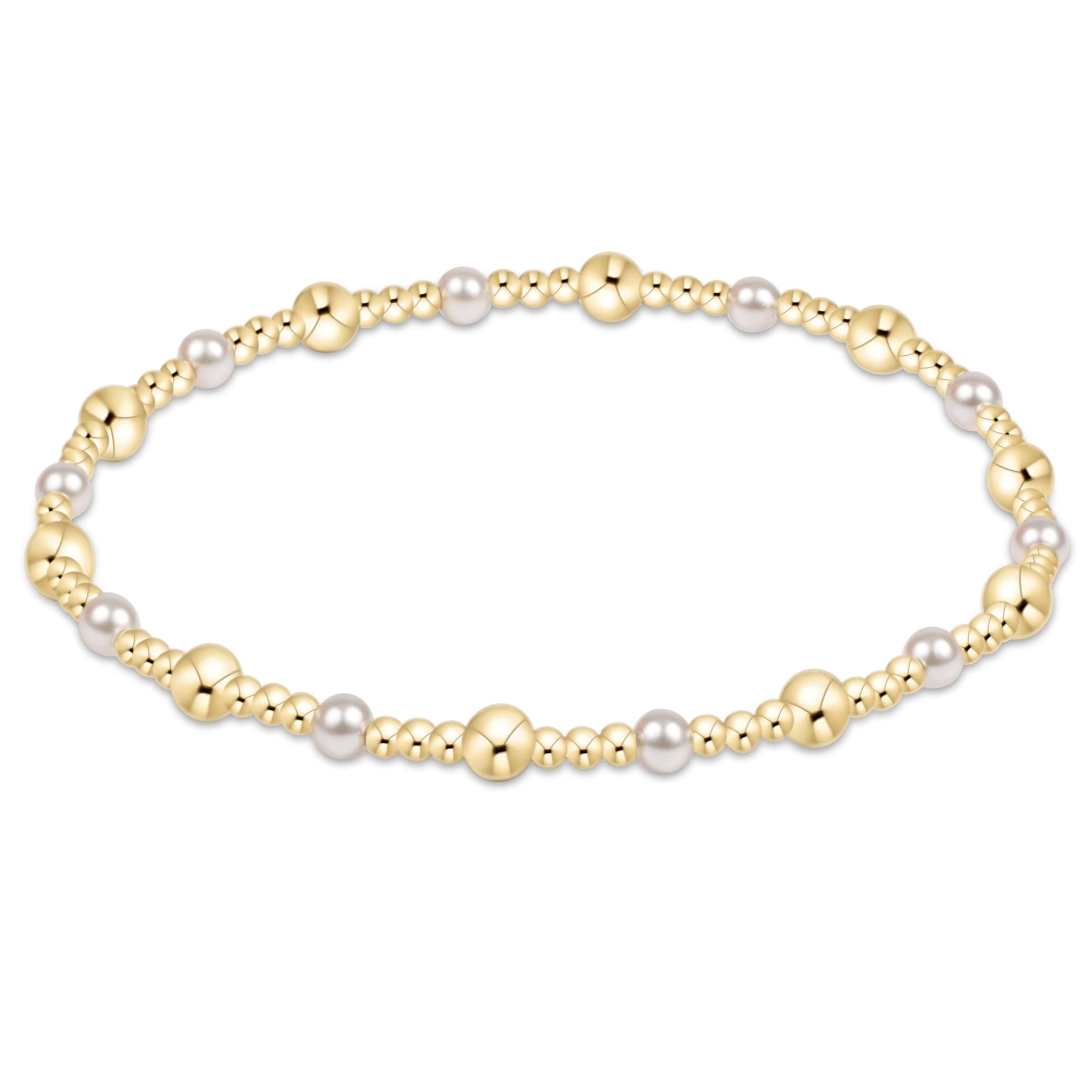 Classic gold sincerity pattern bracelet featuring 4mm crystal pearls mixed with small 14kt gold-filled beads on elastic cord.