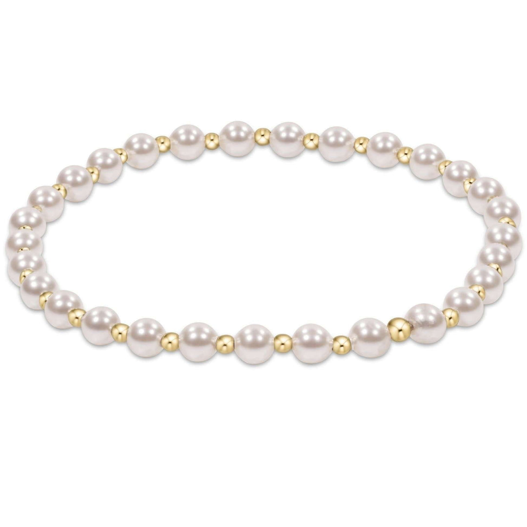 Gold beaded bracelet with alternating 4mm pearl crystals and 2mm beads in a classic grateful pattern.