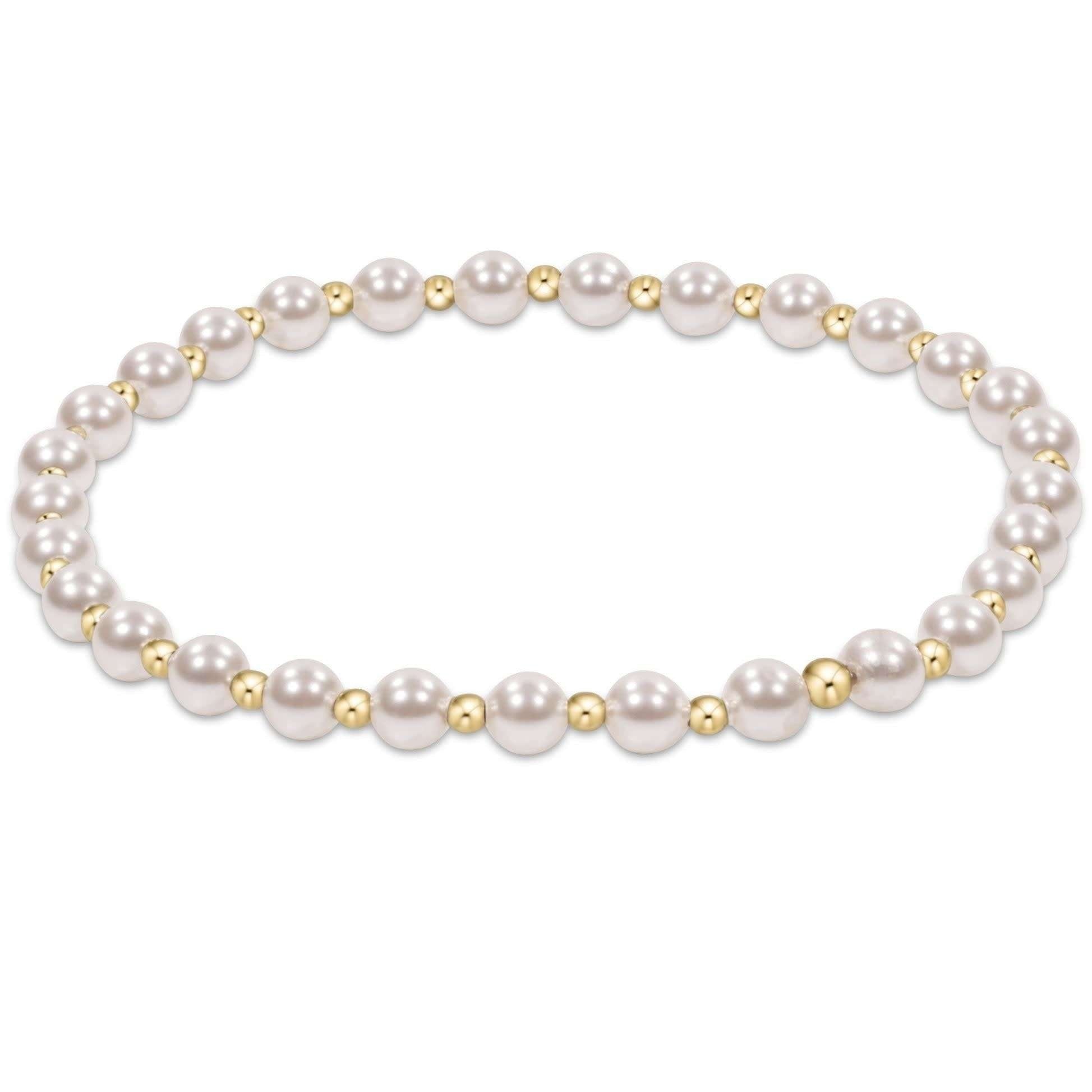 Gold beaded bracelet with alternating 4mm pearl crystals and 2mm beads in a classic grateful pattern.