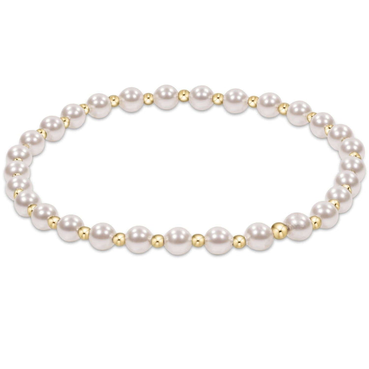 Gold beaded bracelet with alternating 4mm pearl crystals and 2mm beads in a classic grateful pattern.