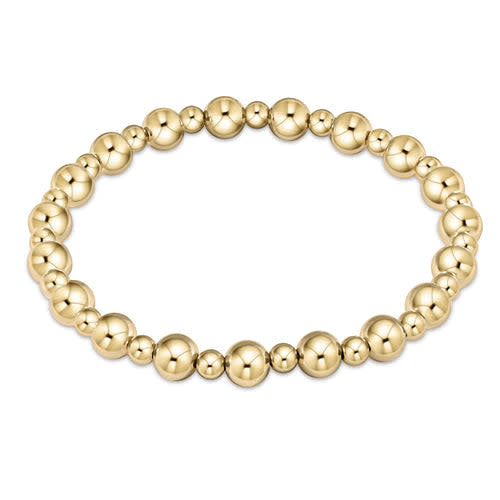 Gold classic beaded bracelet with alternating 6mm and 4mm beads on elastic cord.