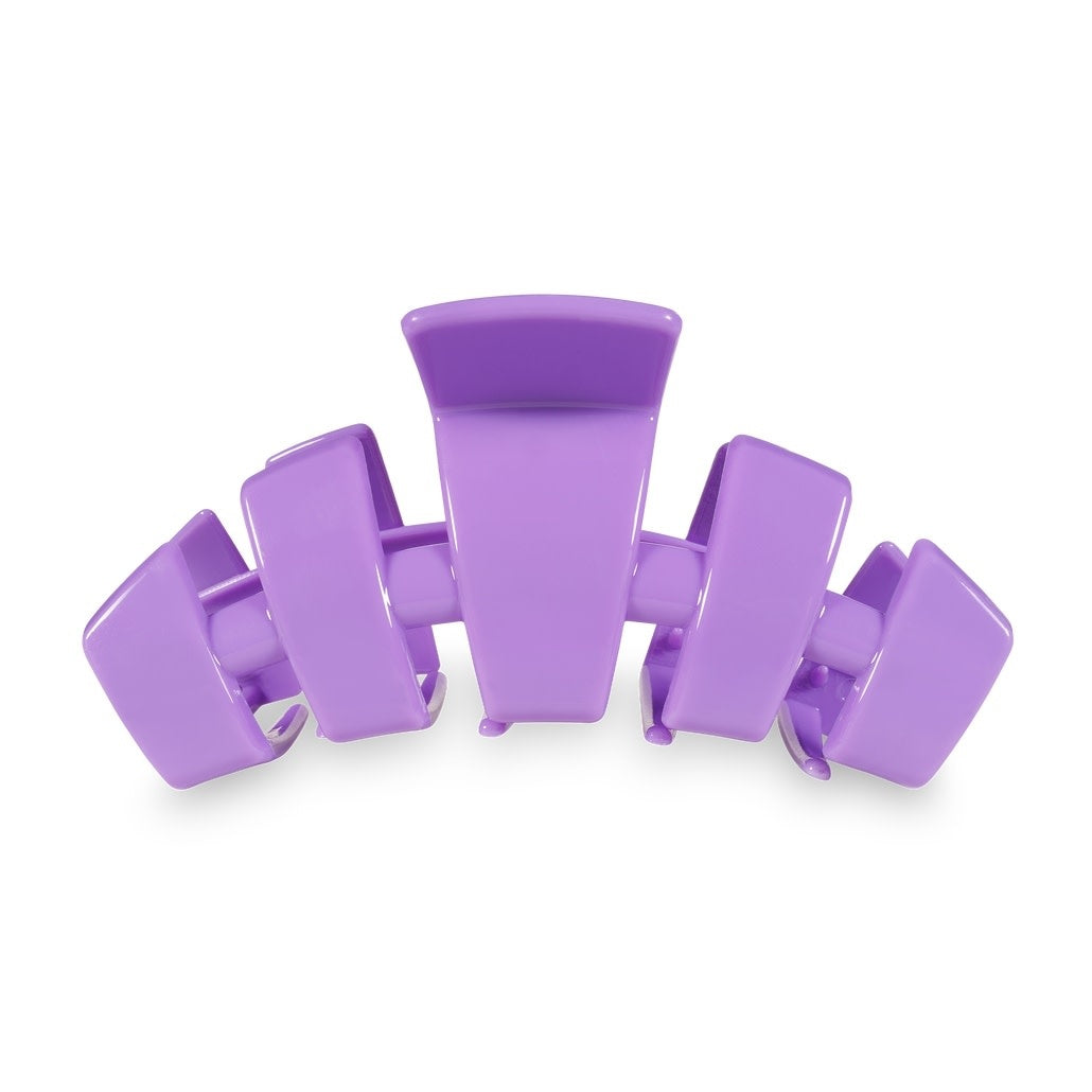 Large classic hair clip with bendable teeth in a neutral tone.