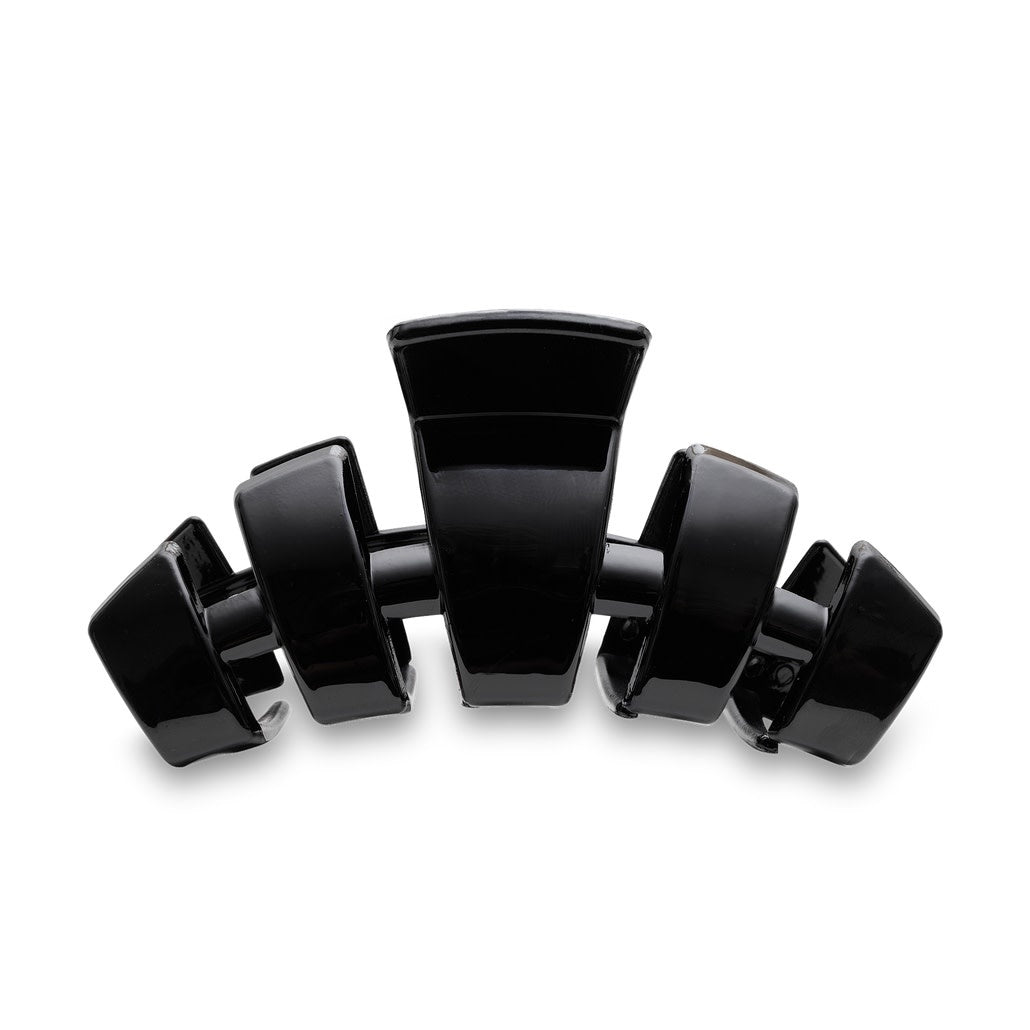 Large jet-black hair clip with bendable teeth designed for thick hair.
