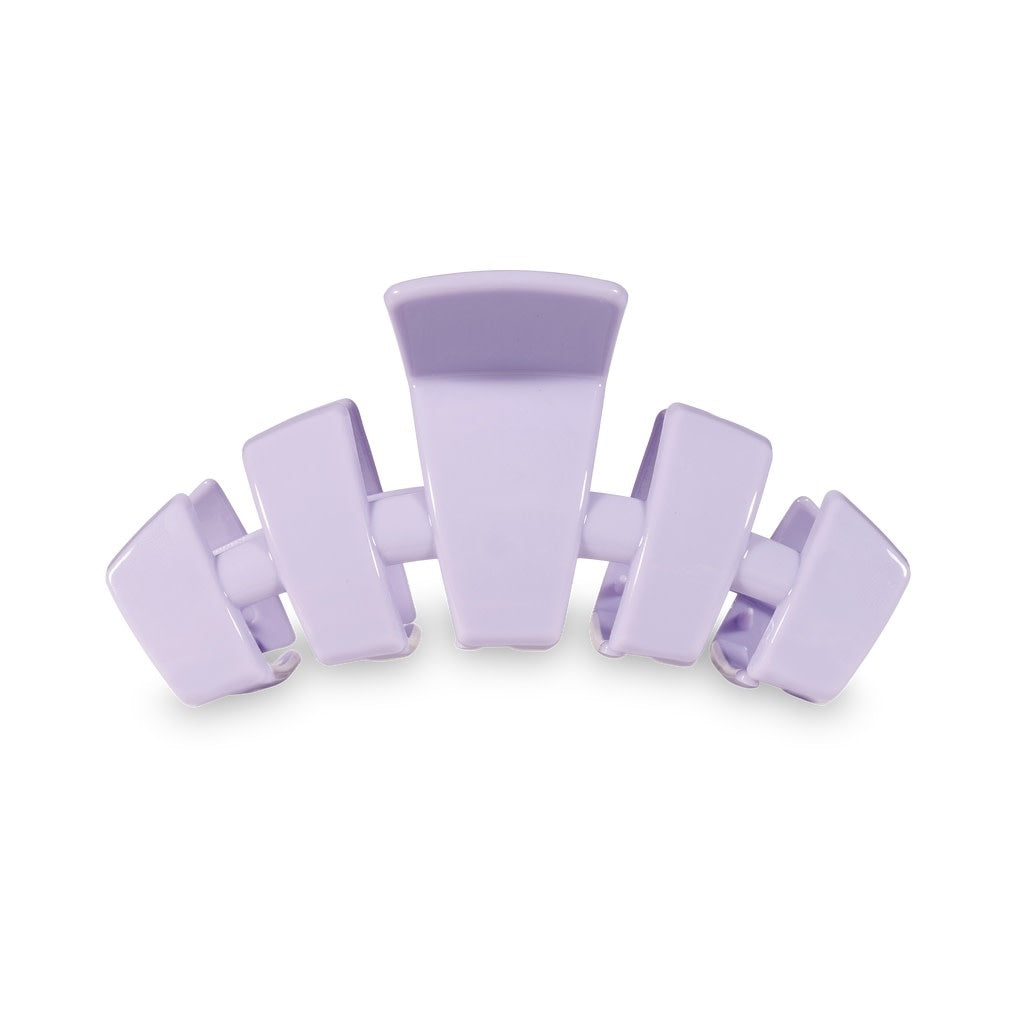 Large lilac hair clip with flexible teeth designed for thick hair.