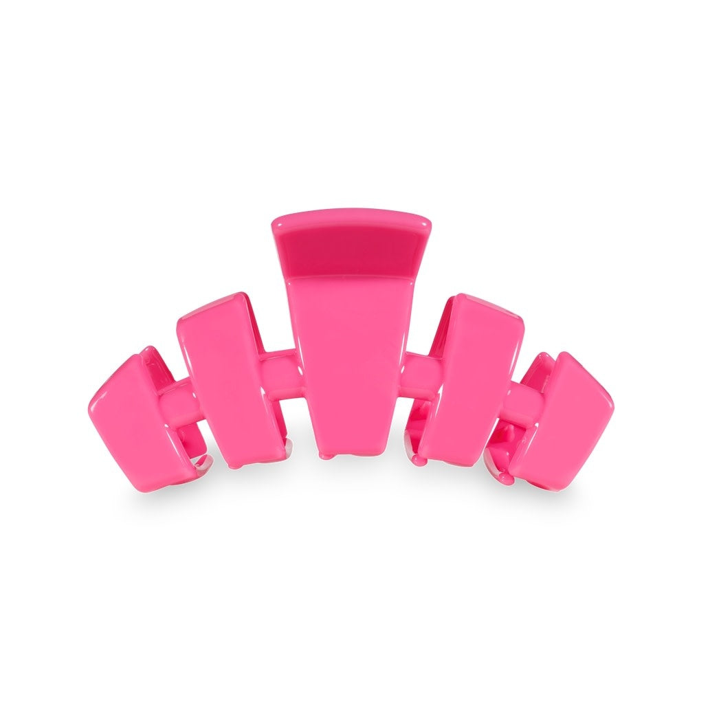 Medium-sized classic hair clip in paradise pink with a smooth plastic finish.