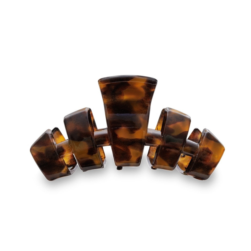 Tortoise shell medium hair clip with a classic curved silhouette.