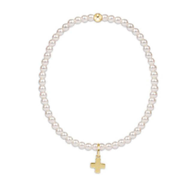 Classic Pearl bracelet featuring 3mm pearls and gold-filled beads with a signature cross charm on elastic cord.