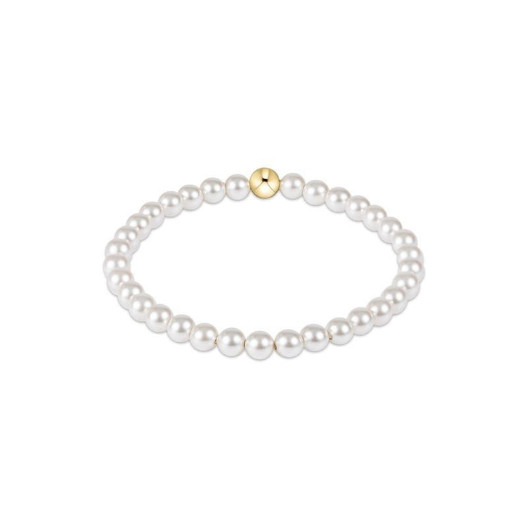 Classic pearl bracelet featuring five-millimeter round beads on a silver chain.