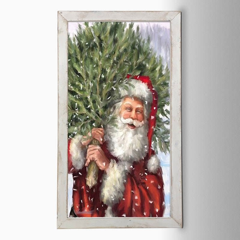 White matte print on reclaimed barn wood frame showing a classic Santa standing beside a Christmas tree.