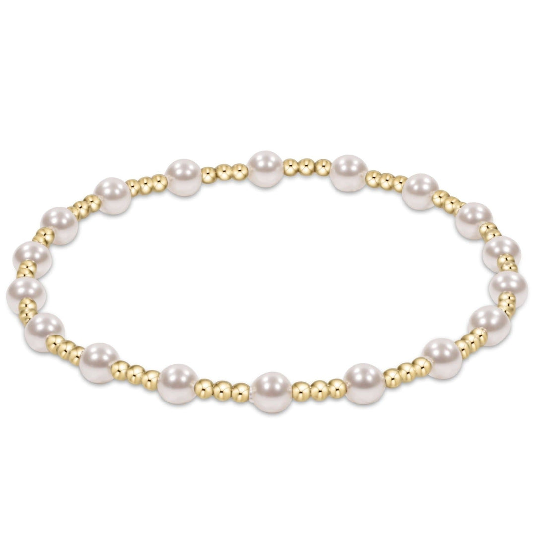 Gold beaded bracelet with alternating 4mm crystal pearls and 2mm beads in a classic sincerity pattern.