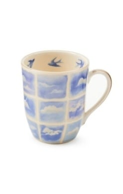Handmade stoneware mug with a cloud-shaped handle in neutral tones.