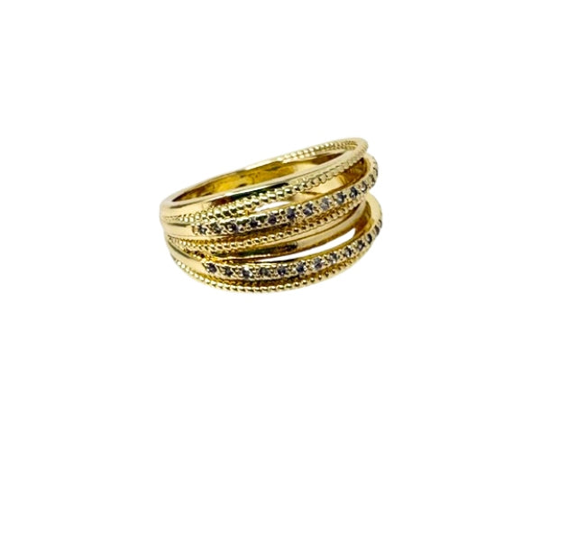 Gold-tone multi-band statement ring with textured beaded edges and pavé-set crystals.