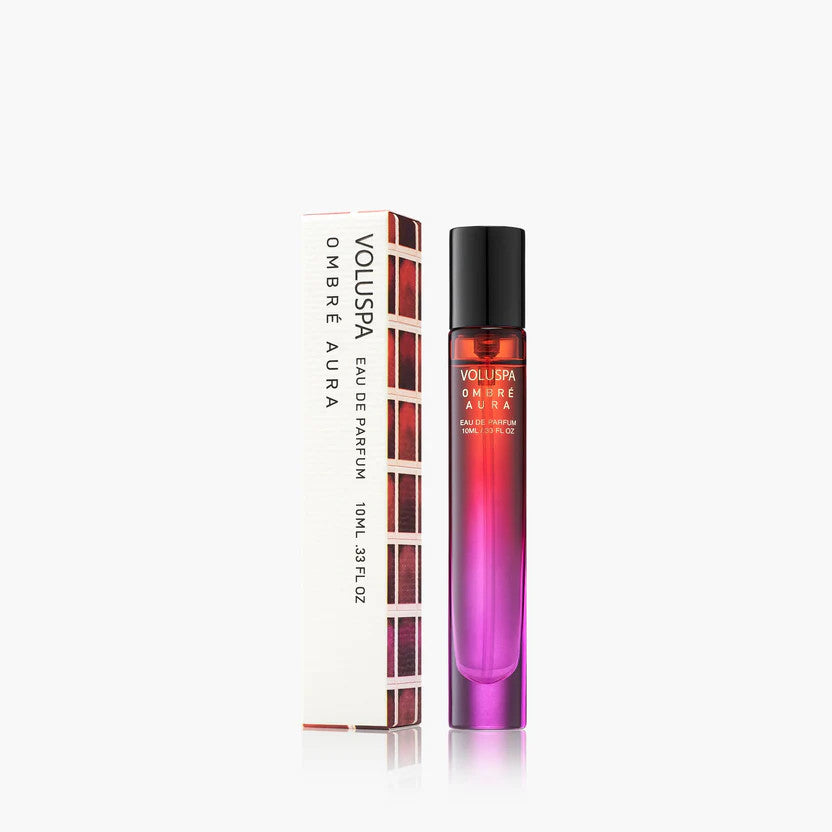 Bottle of Ombre Aura Eau De Parfum with a gradient amber liquid inside and a sleek cap.