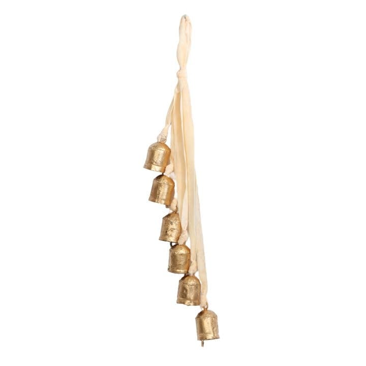 Cluster of six ivory and gold bells strung on a string.