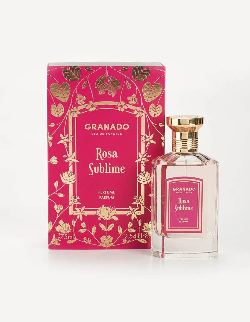 Rosa Sublime Eau de Parfum by Granado in a 75ml glass bottle next to its pink and gold floral box.
