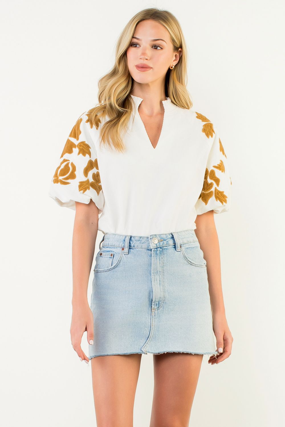 Sophia white puff sleeve top with mustard chenille floral embroidery and a v-neckline.