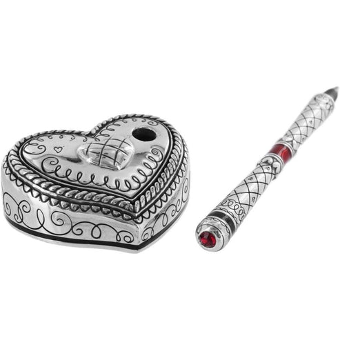 Silver plated heart-shaped pen holder with etched designs and matching pen with red crystal accents.