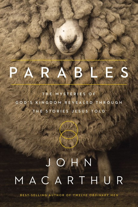 Paperback book titled Parables by John MacArthur with a white cover featuring black text and a subtle cross design.