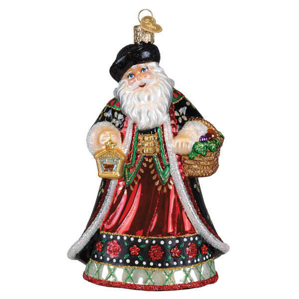 Slovak Father Christmas glass ornament wearing a black hat and red robe, holding a lantern.