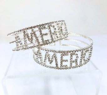 Silver stretch cuff bracelet featuring the word AMERICA in sparkling rhinestones.