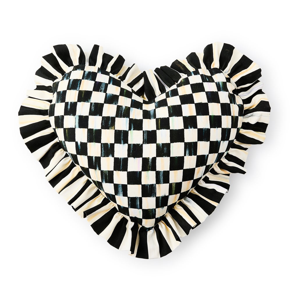 Cotton heart-shaped throw pillow with ruffled edges in a neutral tone.