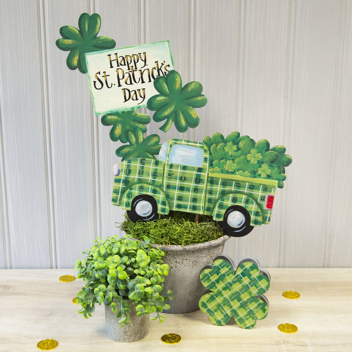 Green shamrock-shaped metal garden stake with 'Happy St. Pat's' text.