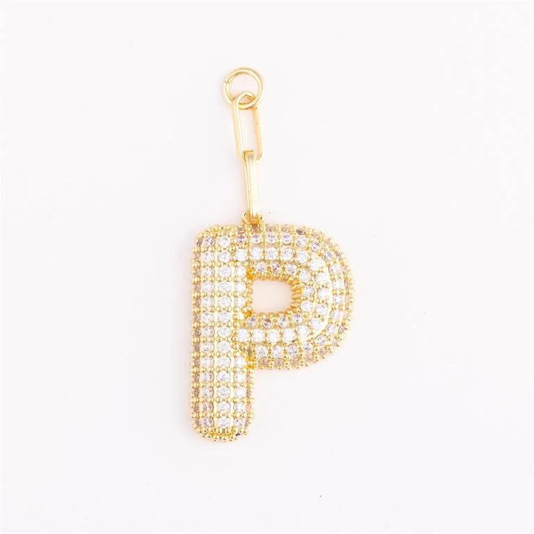 Heather-colored charm bag with gold plating, pave crystal accents, and a customizable initial on an extender chain.