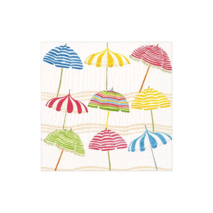 Triple-ply cocktail napkins with a beach umbrella print in blue and white.