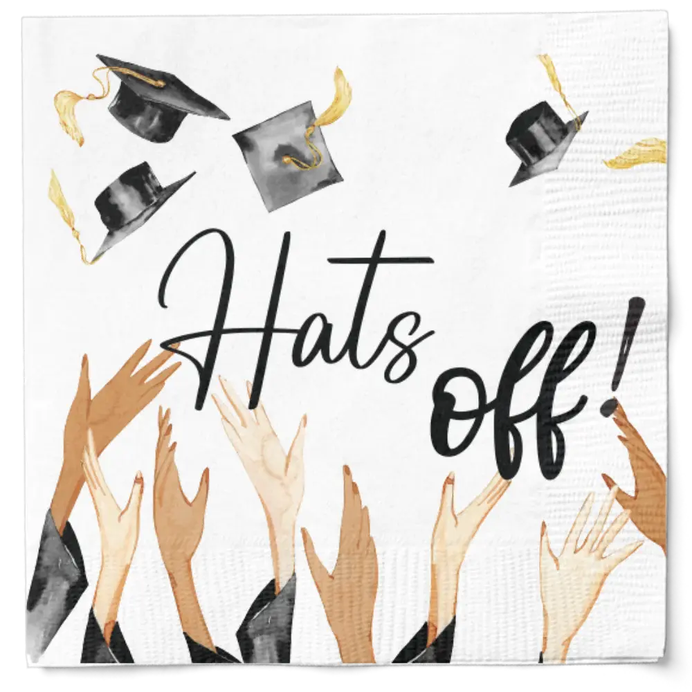 White two-ply cocktail napkin featuring black text and illustrations of graduation caps with hands.