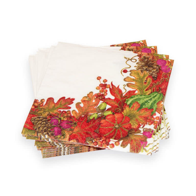 White triple-ply cocktail napkin featuring a harvest garland pattern with green foliage and autumnal accents.