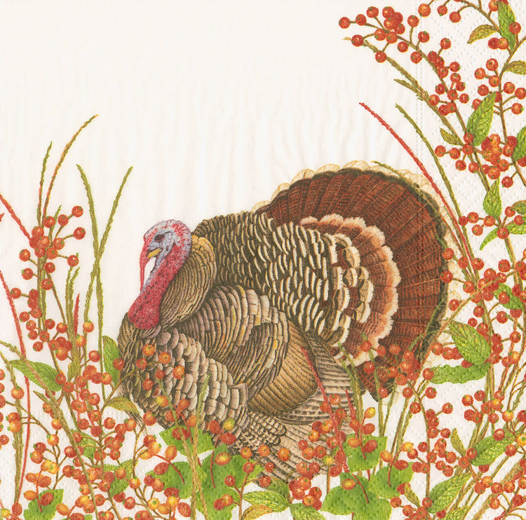 Triple-ply cocktail napkins featuring a turkey surrounded by red berries on an off-white background.