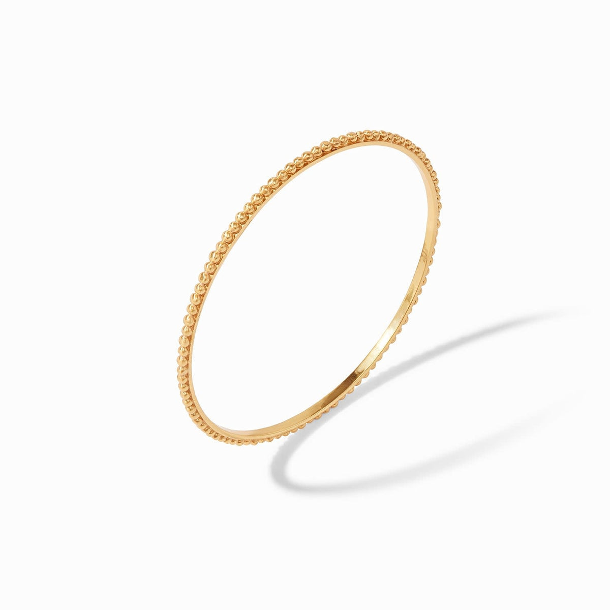 Slender gold-plated bangle with raised bead detail and Julie Vos hallmark.