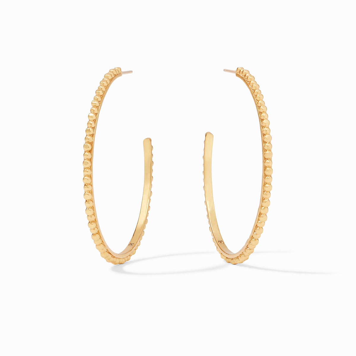 Extra-large gold hoop earring with raised bead detailing.