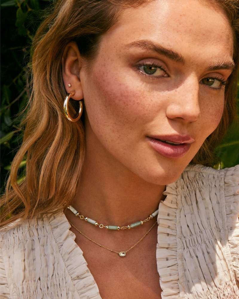 Colette hoop earrings in 14k yellow gold over brass with an earpost closure.